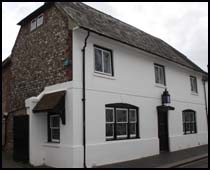 Double fronted brick or flint faced